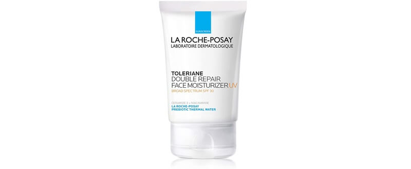 a white and blue tube of the La Roche-Posay Toleriane Double Repair Face Moisturizer UV. On the tube, it says LA ROCHE-POSAY LABORATOIRE DERMATOLOGIQUE, TOLERIANE DOUBLE REPAIR FACE MOISTURIZER UV, BROAD SPECTRUM SPF 30, CERAMIDE-3 + NIACINAMIDE, LA ROCHE-POSAY, PREBIOTIC THERMAL WATER